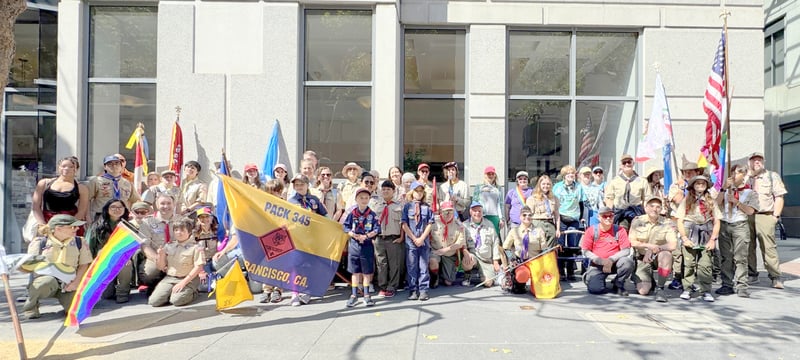 Group picture of Scouts and flags at San Francisco pride Parade